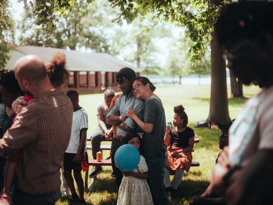 A big family gathered outdoors at a reunion