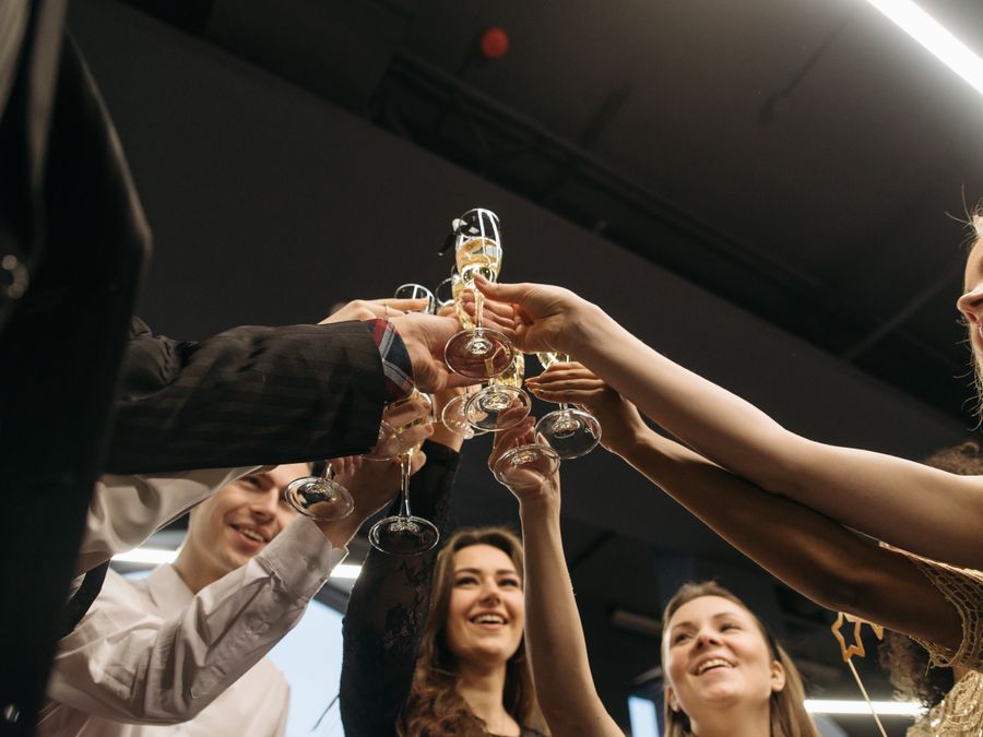 Old friends celebrating together with a toast